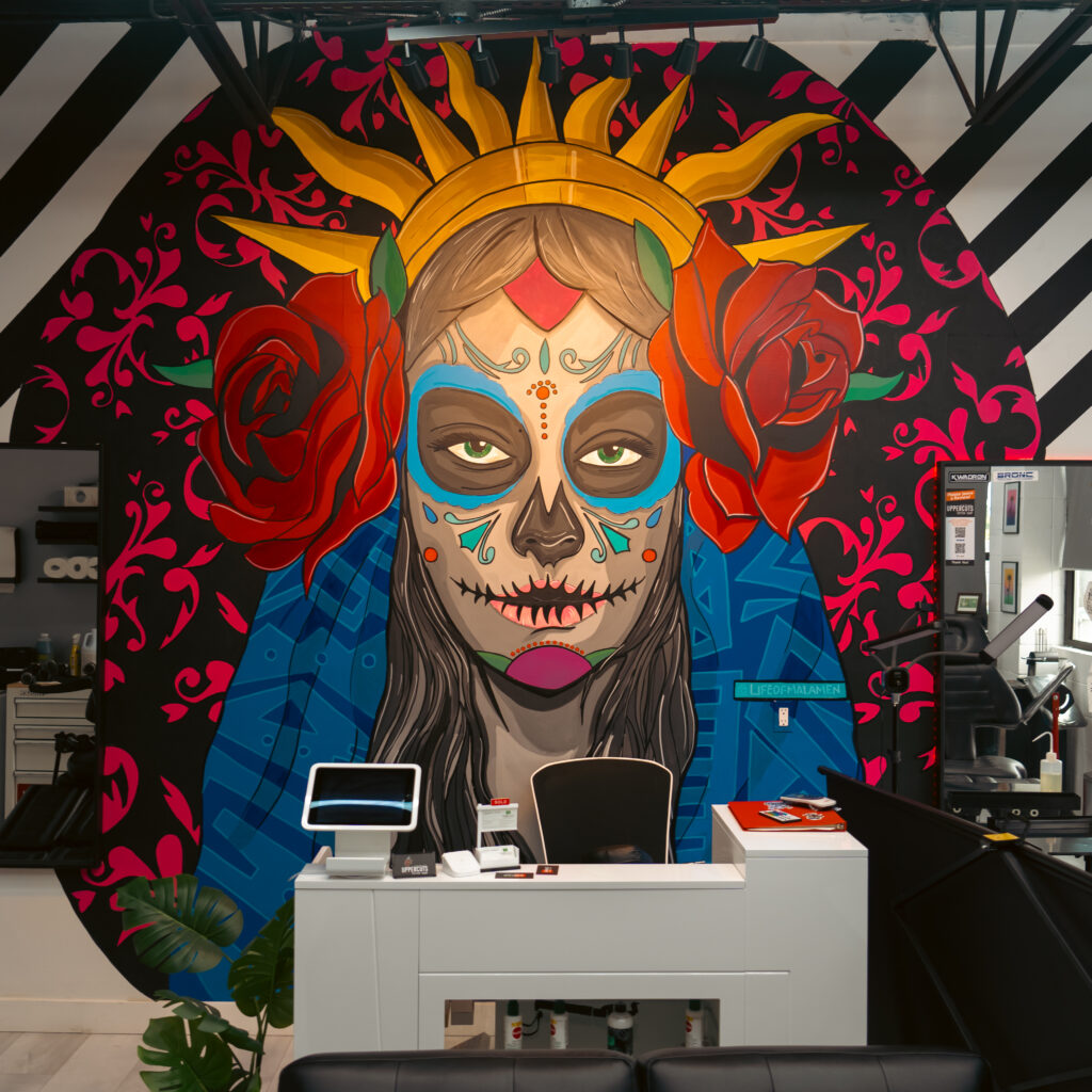 Reception desk and Day of the Dead mural inside Uppercuts Tattoo Shop, Maple Ridge