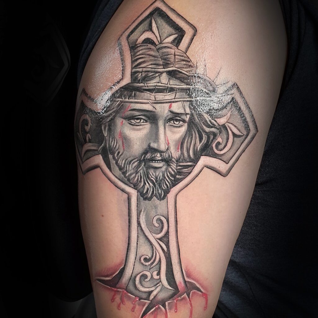 Black and grey religious cross tattoo by Uppercuts Tattoo Shop, Maple Ridge BC
